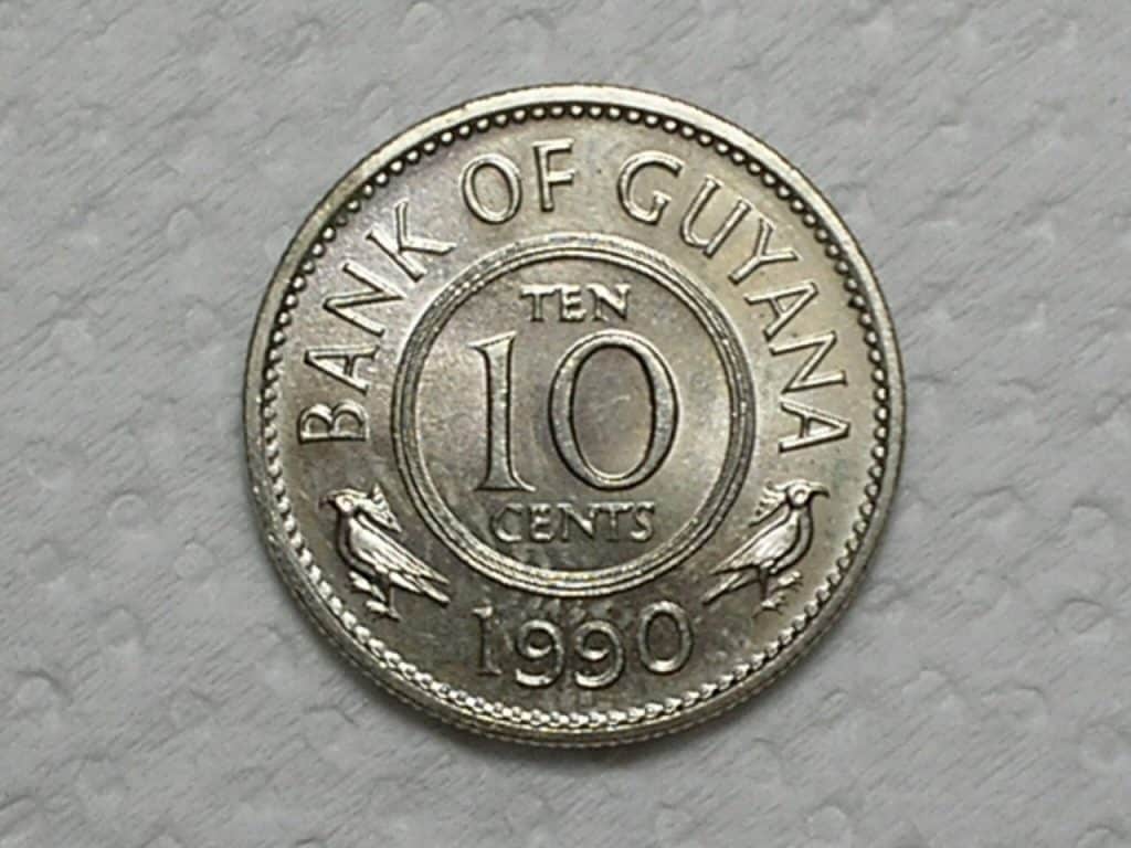Guiania) 10 Cent - 1990 / Ni / Flor de Cunho / box4