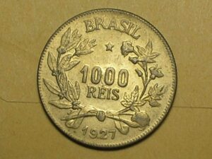 . Flor - 1.000 Réis - 1927 / Mulher sentada / Flor de cunho com brilho do cunho.