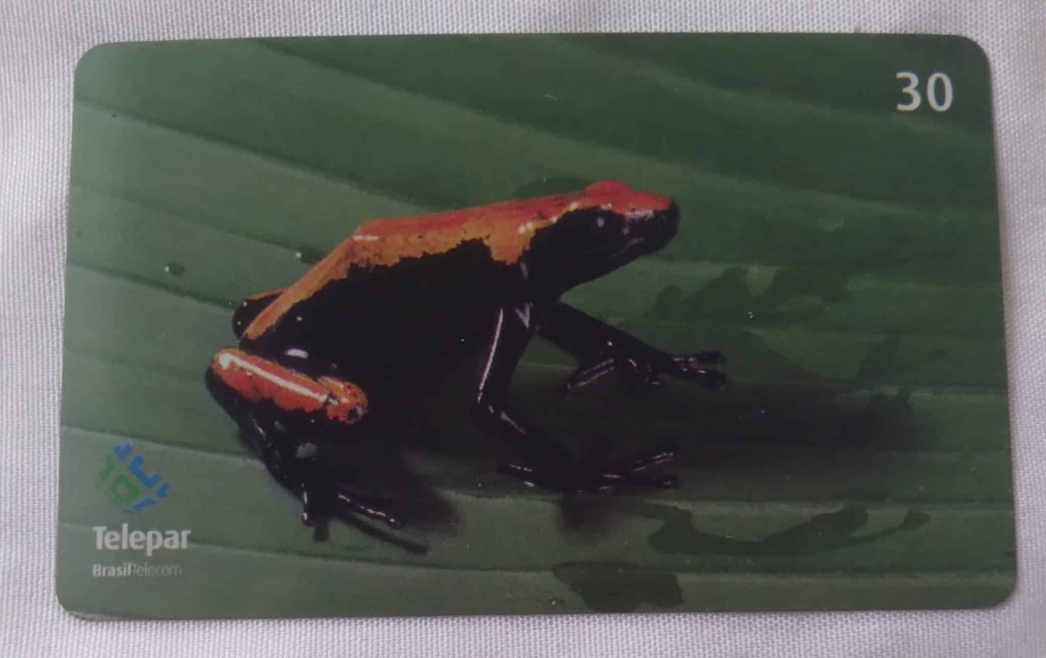 Cartão telefone Brasil Telepar BRT 2001. Curiosidades Sapinho venenoso laranja.