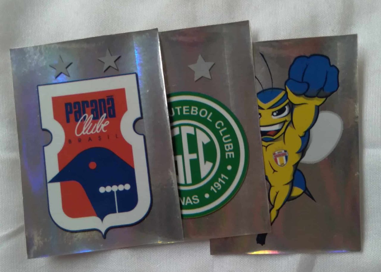 241T Figurinhas Panini Campeonato Brasileiro 2012. Símbolo. Valor de cada.