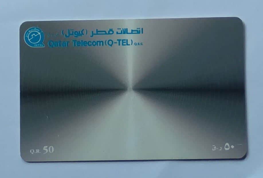 Cartão telefone Qatar Q Tel. Imagem símbolo.