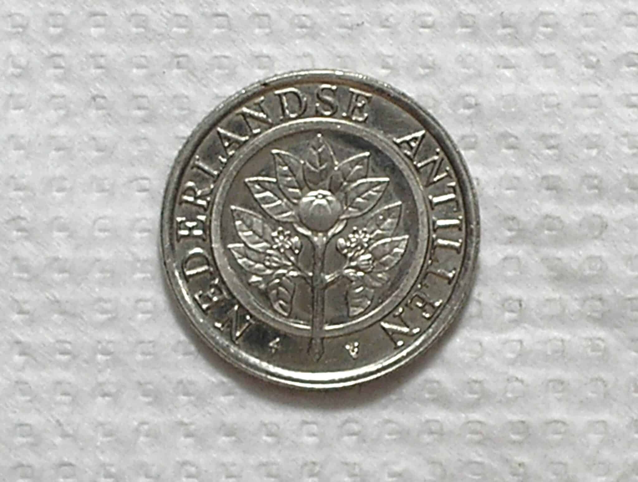 Netherland Antilles) 25 Cents - 1989 / 1ª da Série / 20mm / Ni/St / Flor de cunho / box53