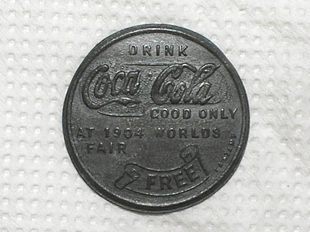 Ficha da Coca Cola - 1904 / Metal Zinco com 30 mm diâmetro / m470