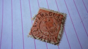 SELO 100 RÉIS COM CARIMBO VILLA-PARAGUASSU LOTE 1112 .