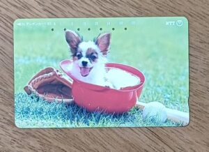 Cartao telefone Japão NTT 231 200. Cachorrinho Bola de golfe.