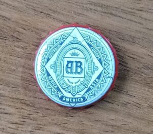 Embalagem tampinha cerveja AB.