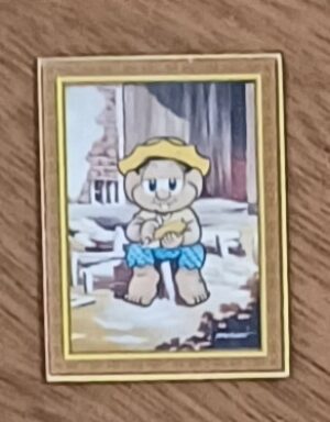 Imã de geladeira Maurício. Quadro Chico tirando palha de milho..