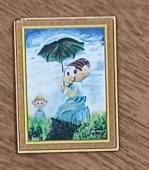 Imã de geladeira Maurício. Quadro Mônica com sombrinha.