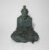 Escultura representando mestre Chinês sentado meditando